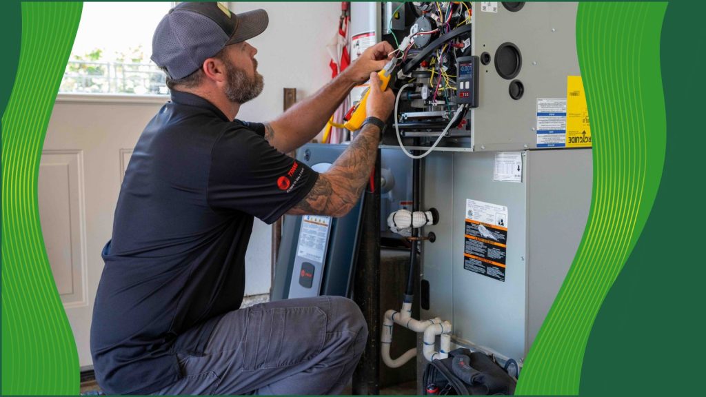 A Mahalo HVAC tech working on a heating system.